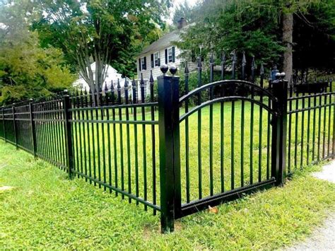 old house with metal fences|history of metal fences.